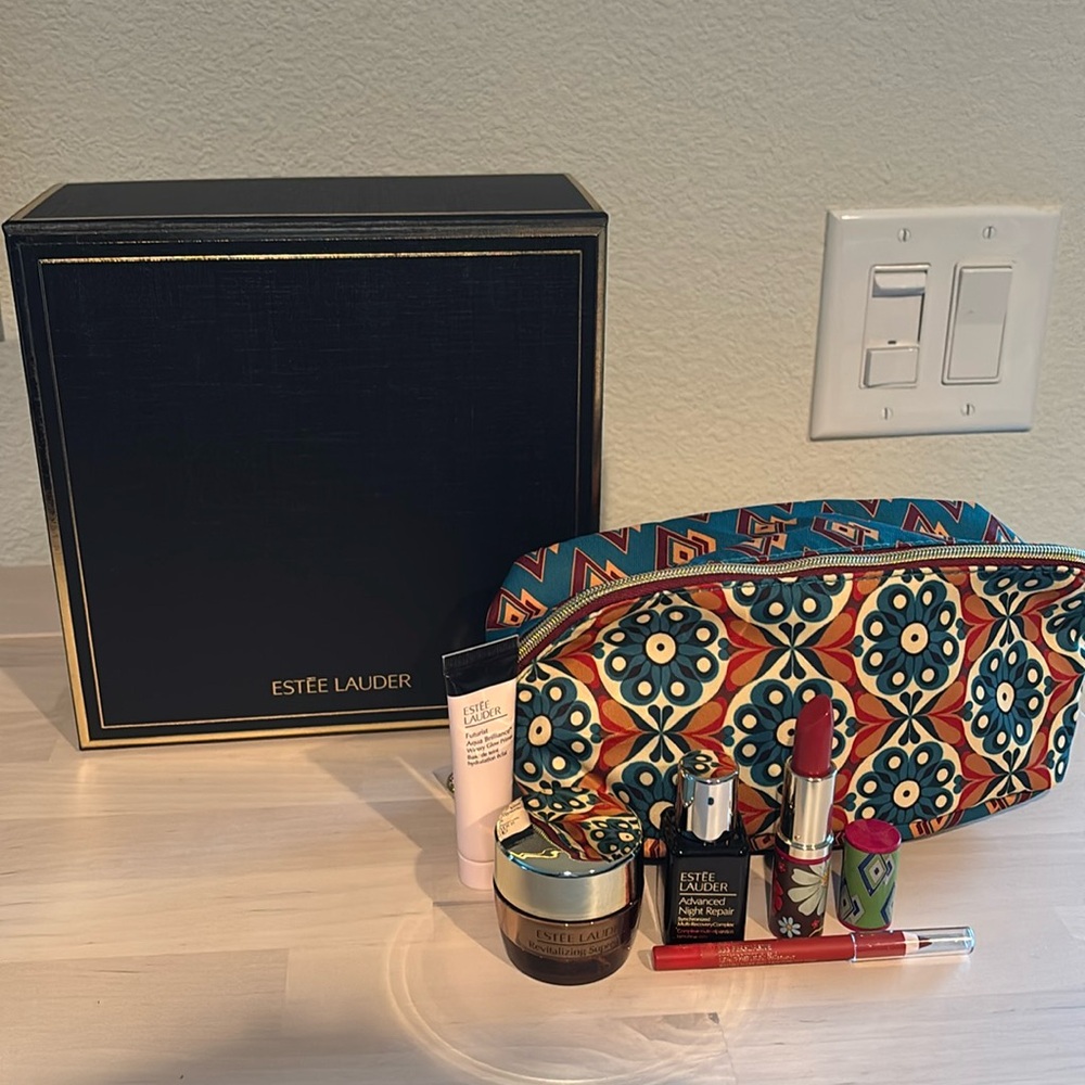 Estée Lauder cosmetic bag and makeup/skincare bundle
